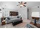 Spacious living room featuring plush seating, a built-in bookcase, and neutral decor at 700 Mill Creek Cv, Canton, GA 30115