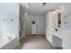 Bright main bathroom featuring a soaking tub, a glass-enclosed shower, and stylish vanity with ample storage at 700 Mill Creek Cv, Canton, GA 30115