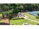 Community playground and tennis court in a wooded setting, perfect for active recreation and outdoor enjoyment at 700 Mill Creek Cv, Canton, GA 30115