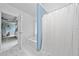 Bright bathroom features a large tub and access to primary bedroom at 701 Robert Ln, Canton, GA 30114