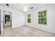 Minimalist bedroom with ample natural light from two windows and neutral decor at 701 Robert Ln, Canton, GA 30114