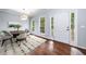 Dining room featuring hardwood floors, natural light, and modern furnishings at 701 Robert Ln, Canton, GA 30114