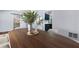 Dining room featuring hardwood table, plants, and seating for six at 701 Robert Ln, Canton, GA 30114