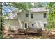 A backyard view of a house featuring a deck and siding at 701 Robert Ln, Canton, GA 30114