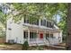 Charming two-story home with a welcoming front porch and white railings at 701 Robert Ln, Canton, GA 30114