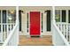 Inviting front porch with a bright red door, black shutters, and white railings at 701 Robert Ln, Canton, GA 30114