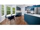 Charming eat-in kitchen with dark blue cabinets, stainless appliances, and hardwood floors at 701 Robert Ln, Canton, GA 30114