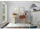Bright home office featuring a modern desk, chair, and natural light at 701 Robert Ln, Canton, GA 30114