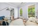 Spacious home office featuring natural light, desk, chair, and a comfortable sofa at 701 Robert Ln, Canton, GA 30114
