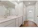 Bathroom featuring double sink vanity, white cabinets, and hardwood floors at 777 Ruddy Drive (Lot20), Grayson, GA 30017