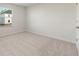 Bedroom showing neutral carpet and natural light from a single window at 777 Ruddy Drive (Lot20), Grayson, GA 30017