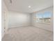 Spacious bedroom with plush carpeting, a large window, and ample natural light at 777 Ruddy Drive (Lot20), Grayson, GA 30017