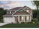 Charming two-story home with a welcoming front porch, well-manicured lawn, and an attached two-car garage at 777 Ruddy Drive (Lot20), Grayson, GA 30017