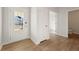 Bright foyer featuring a glass-paneled front door, hardwood flooring, closet, and views to additional rooms at 777 Ruddy Drive (Lot20), Grayson, GA 30017