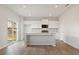 Open kitchen features a large center island and stainless steel appliances at 777 Ruddy Drive (Lot20), Grayson, GA 30017