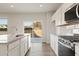 Bright kitchen features stainless appliances, granite countertops, and modern finishes at 777 Ruddy Drive (Lot20), Grayson, GA 30017