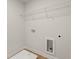 Bright laundry room featuring convenient overhead shelving and utility connections at 777 Ruddy Drive (Lot20), Grayson, GA 30017