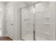 Modern shower showcasing glass doors and built in shelving at 777 Ruddy Drive (Lot20), Grayson, GA 30017