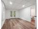 Finished basement with wood floors, french doors, and access to bathroom at 2863 Landing Dr, Marietta, GA 30066