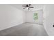 Spacious bedroom with a ceiling fan, plush gray carpet and a window at 2863 Landing Dr, Marietta, GA 30066