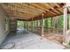 Large wooden deck with concrete patio beneath, surrounded by lush trees at 2863 Landing Dr, Marietta, GA 30066