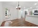 Open dining room adjacent to a modern kitchen with stainless steel appliances and white cabinetry at 2863 Landing Dr, Marietta, GA 30066