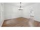 Elegant dining room with beautiful hardwood floors, crown molding, and a modern chandelier at 2863 Landing Dr, Marietta, GA 30066