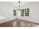 Bright dining room with hardwood floors and windows offering serene views of the surrounding trees at 2863 Landing Dr, Marietta, GA 30066