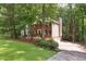 Exterior view of a two-story home with a brick front, siding, and a driveway at 2863 Landing Dr, Marietta, GA 30066