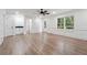 Spacious living room with a wet bar, wainscoting, and a ceiling fan at 2863 Landing Dr, Marietta, GA 30066