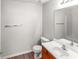 Bathroom featuring a sink with wood cabinets, a toilet, and a large mirror at 3134 Imperial Sw Cir, Atlanta, GA 30311