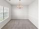 Elegant dining room with a modern chandelier, large window, and ample space for hosting gatherings at 3134 Imperial Sw Cir, Atlanta, GA 30311