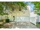 View of the house's rear exterior, garage, and driveway on a sunny day at 3134 Imperial Sw Cir, Atlanta, GA 30311