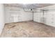 Spacious unfinished garage with a concrete floor and an automatic door at 3134 Imperial Sw Cir, Atlanta, GA 30311