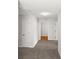 Upstairs hallway featuring carpet and access to multiple bedrooms at 3134 Imperial Sw Cir, Atlanta, GA 30311