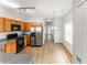 Functional kitchen with wood cabinets, a range gas stove, and stainless steel appliances at 3134 Imperial Sw Cir, Atlanta, GA 30311