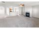 Spacious living room with an open floor plan, fireplace, and neutral walls creating a versatile living space at 3134 Imperial Sw Cir, Atlanta, GA 30311