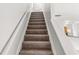 Carpeted staircase leading to the upper level of the home at 3134 Imperial Sw Cir, Atlanta, GA 30311