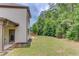 Spacious backyard with lush greenery and patio area at 4241 Summer Breeze Way, Buford, GA 30518