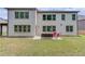 Expansive backyard with a patio seating area, perfect for outdoor gatherings at 4241 Summer Breeze Way, Buford, GA 30518