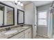 Bathroom featuring double vanity sinks with granite countertops and modern fixtures at 4241 Summer Breeze Way, Buford, GA 30518