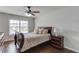 Bedroom with dark wood floors, a large window, and elegant furnishings at 4241 Summer Breeze Way, Buford, GA 30518