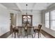 Elegant dining room features coffered ceilings, wainscoting, and large windows at 4241 Summer Breeze Way, Buford, GA 30518