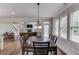 Open dining room with hardwood floors, and lots of natural light from large windows at 4241 Summer Breeze Way, Buford, GA 30518