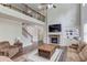 Comfortable living room with stone fireplace, built-ins, and wooden coffee table at 4241 Summer Breeze Way, Buford, GA 30518