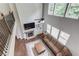 Bright, open living room with fireplace, hardwood floors, and lots of natural light at 4241 Summer Breeze Way, Buford, GA 30518