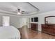 Large main bedroom with hardwood floors, trey ceiling, and en suite bath at 4241 Summer Breeze Way, Buford, GA 30518