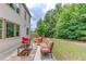 Backyard patio with outdoor furniture surrounded by lush greenery at 4241 Summer Breeze Way, Buford, GA 30518