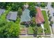 An aerial shot shows the house with its green roof and surrounding mature trees at 636 Cameron Street Se St, Atlanta, GA 30312