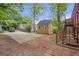 A spacious backyard features a parking area, shed, and a staircase to the upper level of the house at 636 Cameron Street Se St, Atlanta, GA 30312